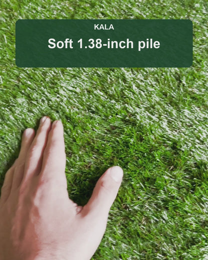 Real KALA artificial grass shown up close by hand, with 1.38-inch pile and 6.5 x 10 ft roll size.